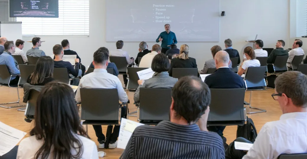 Diverse group of professionals at an Impactful Speaking session