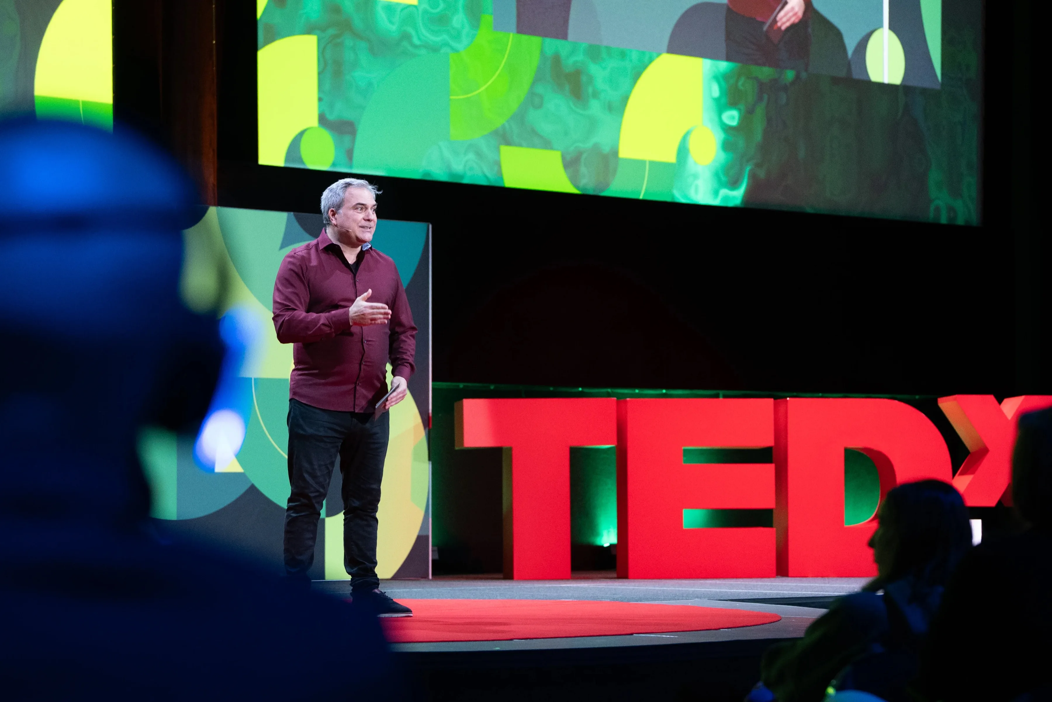 TEDx Lausanne 2025 — speaker on stage coached by Impactful Speaking
